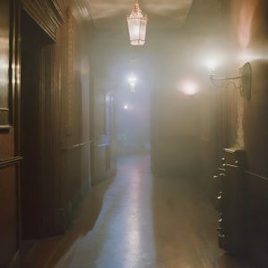A misty hallway inside a haunted mansion
