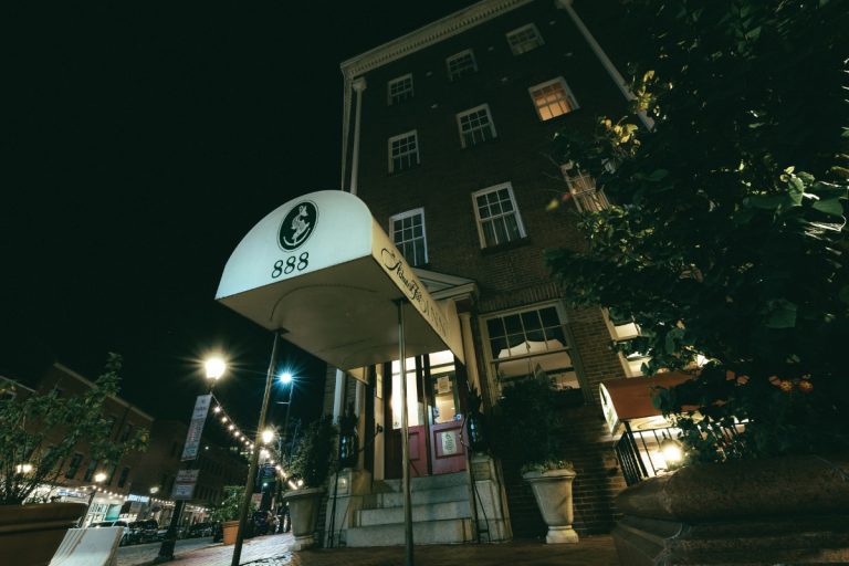 A night time image of the front of The Admiral Inn in Baltimore